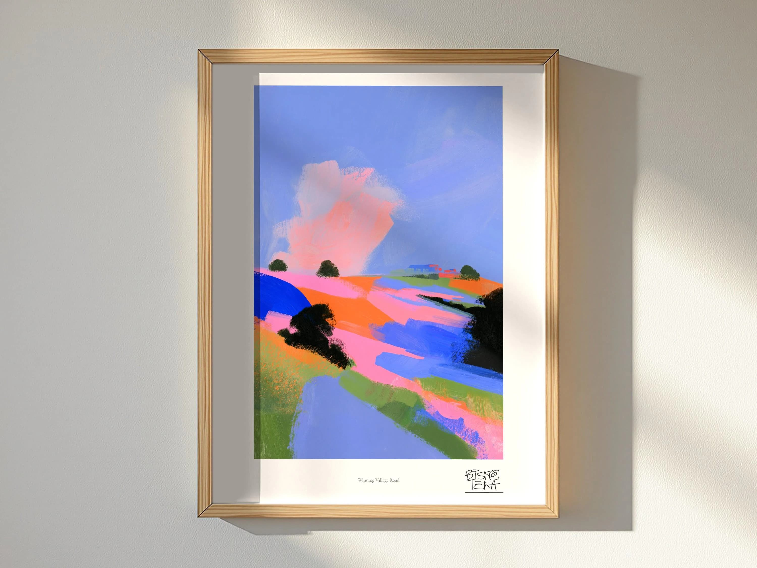 Winding Village Road framed art print, shown hanging in a styled room