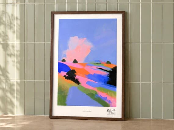 Winding Village Road art print on a wall, room view